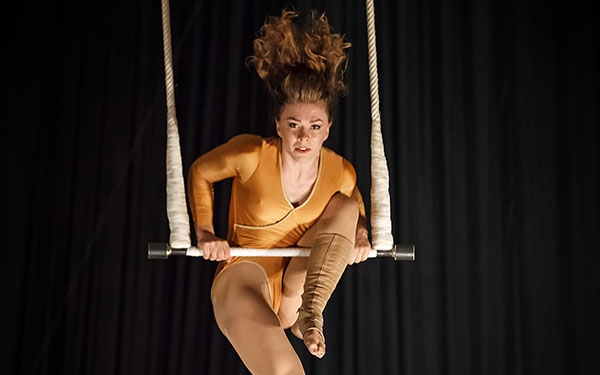 photo of Catherine Jett, NECCA Coach, performing on Trapeze