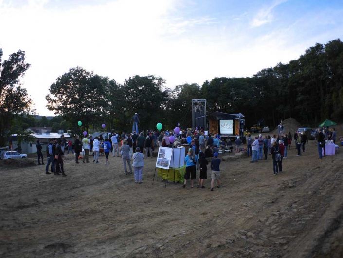 necca-abc-news-10-august-2016-FEAT photo of people celebrating on the construction site for the new NECCA building