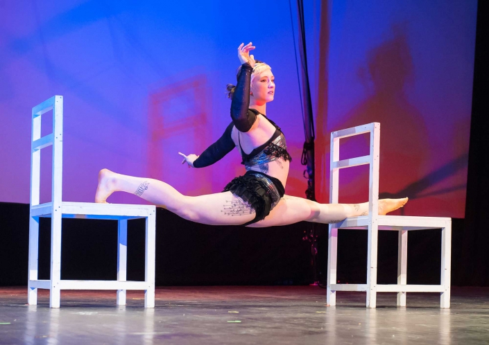 photo of Chloe Wailer performing a split at NECCA's Circus Spectacular in brattleboro vermont
