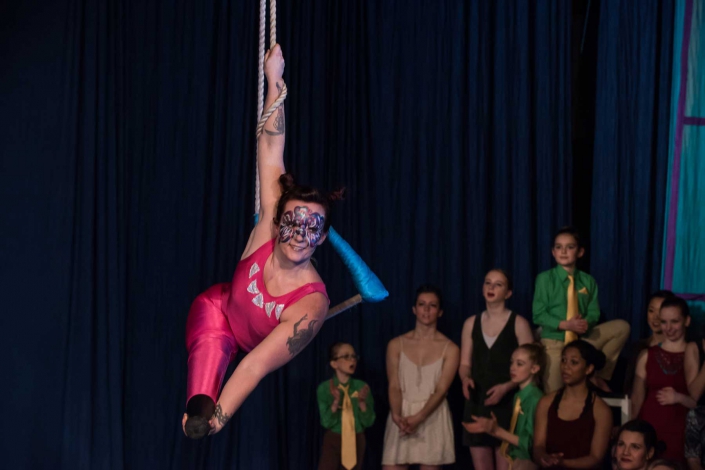 necca-brattleboro-reformer-flying-nut-december-2016-FEAT photo of Erin Ball, double leg amputee, performing at NECCA's Flying Nut Christmas show