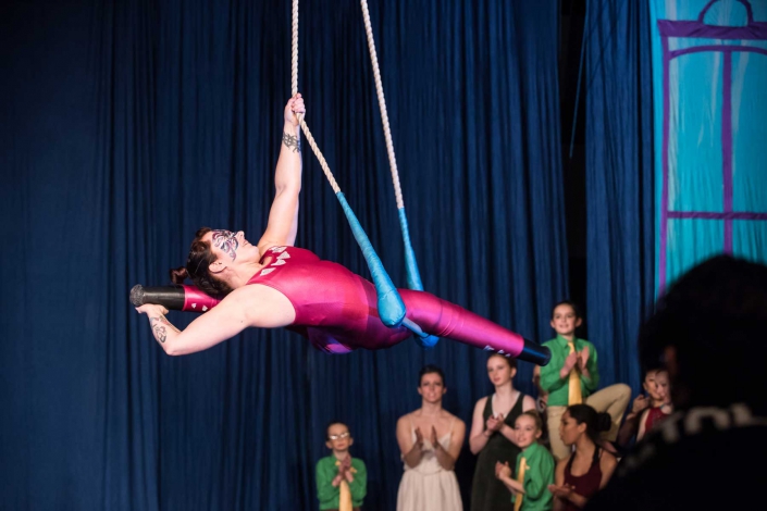 necca-elf-magazine-december-2016-FEAT photo of Erin Ball, double leg amputee, performing at NECCA's Flying Nut Christmas show