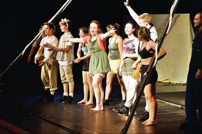 necca-receives-nea-grant-FEAT artist in residence performers standing on stage waving to their audience