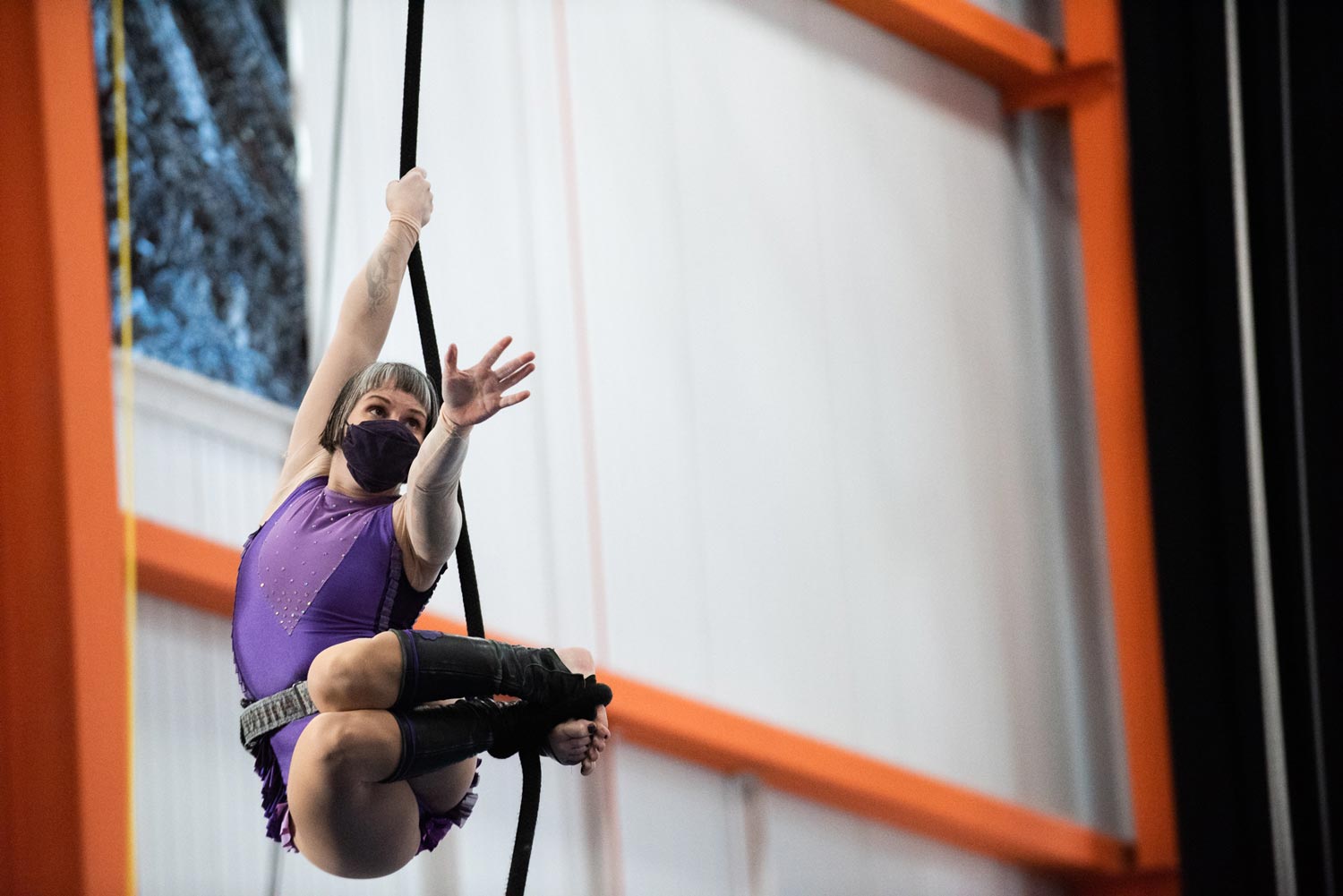 image of an aerialist training on rope