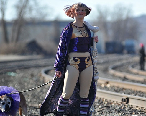 violet defiant in a circus costume with a dog in a tutu