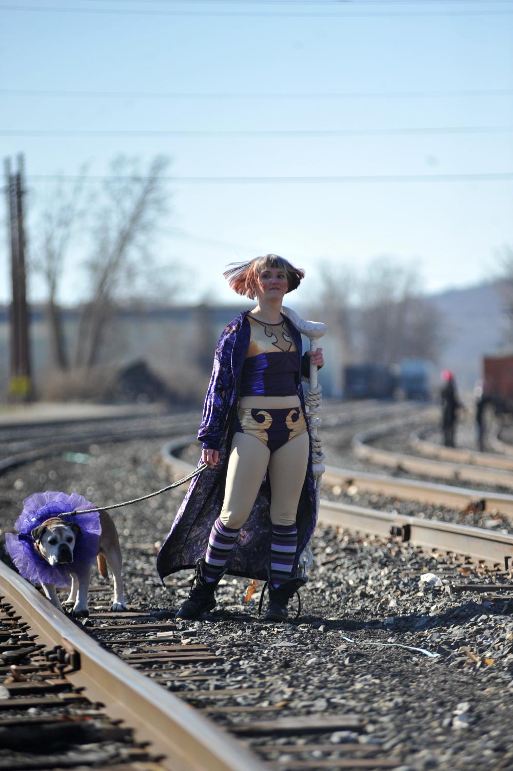 violet defiant in a circus costume with a dog in a tutu